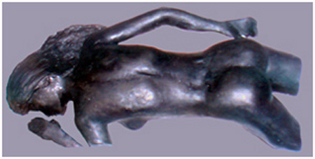 3/4 figure lying face down; painted plaster cast relief./